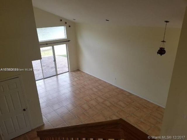 empty room with high vaulted ceiling