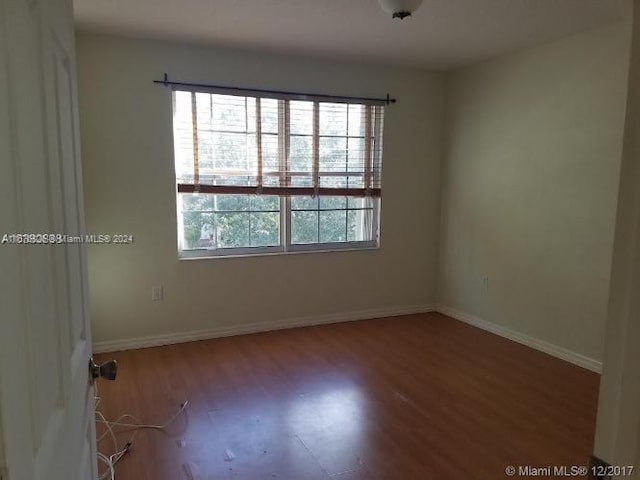 empty room featuring wood-type flooring