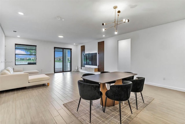 dining space with a chandelier