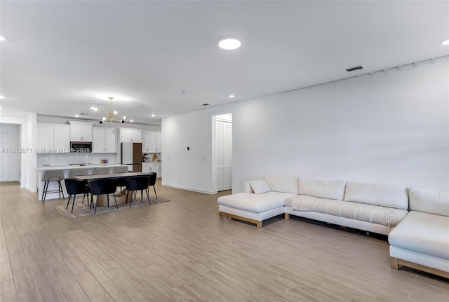 living room with light hardwood / wood-style floors