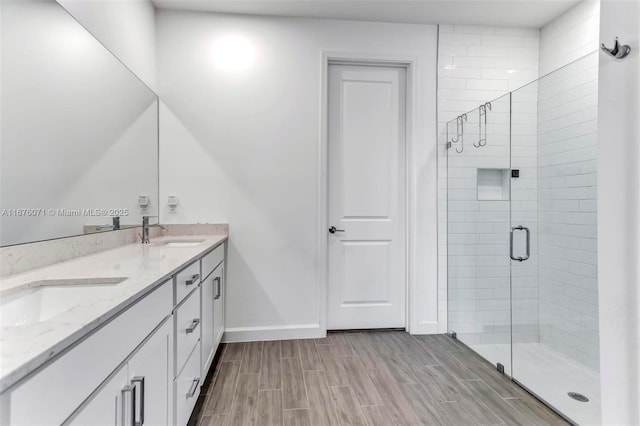 bathroom with vanity and an enclosed shower