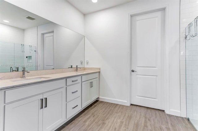 bathroom featuring vanity and walk in shower