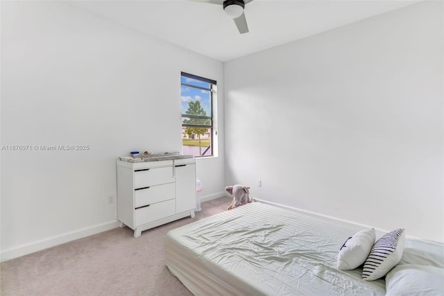 bedroom featuring light carpet and ceiling fan