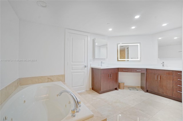 bathroom with vanity, tiled bath, and tile patterned floors