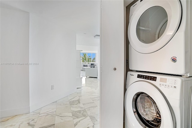 washroom with stacked washer / dryer