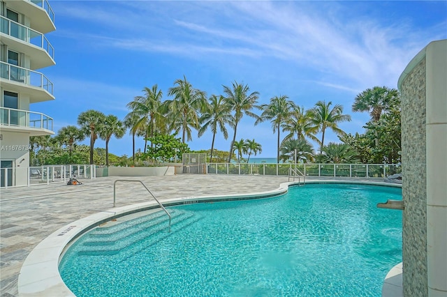 view of swimming pool with a patio