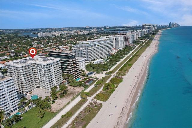 aerial view featuring a view of the beach and a water view