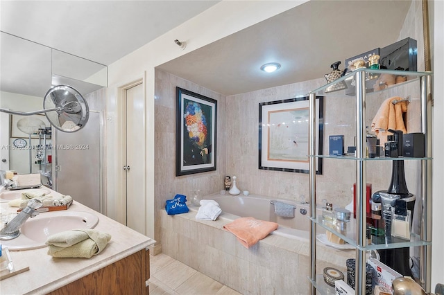 bathroom with vanity, shower with separate bathtub, and tile patterned flooring