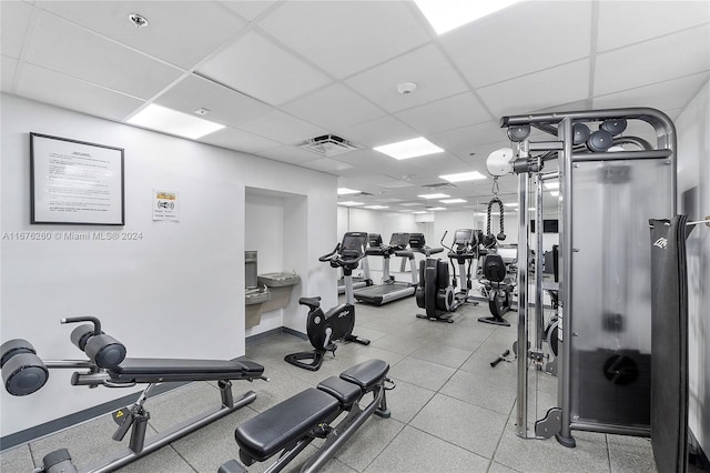 gym featuring a drop ceiling