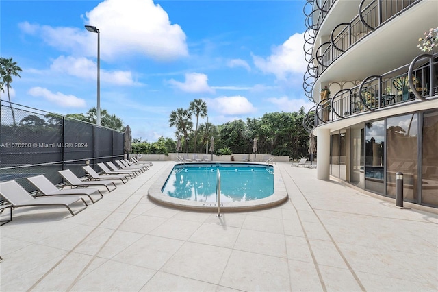 view of pool featuring a patio