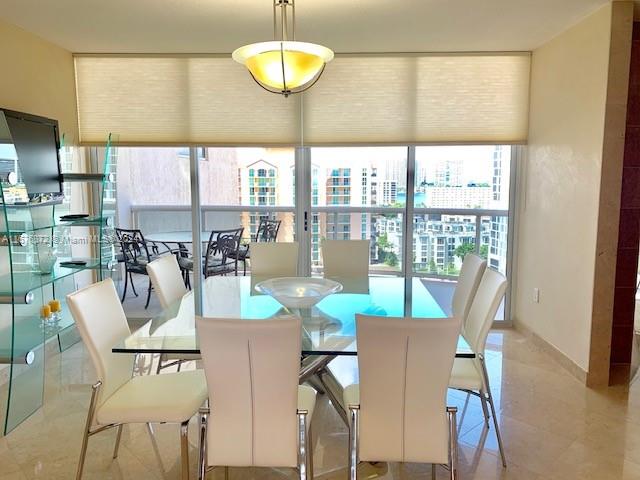 dining space with a healthy amount of sunlight