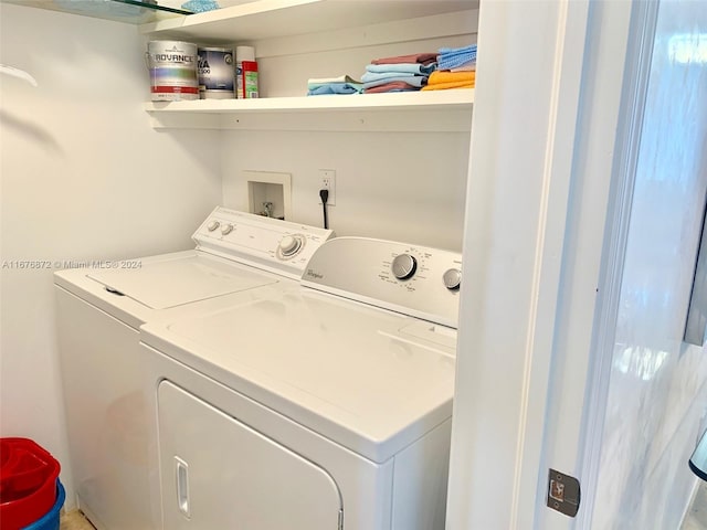 washroom with washer and clothes dryer