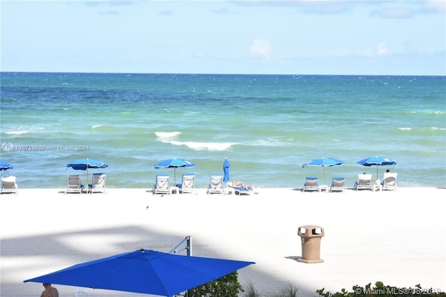 property view of water featuring a beach view