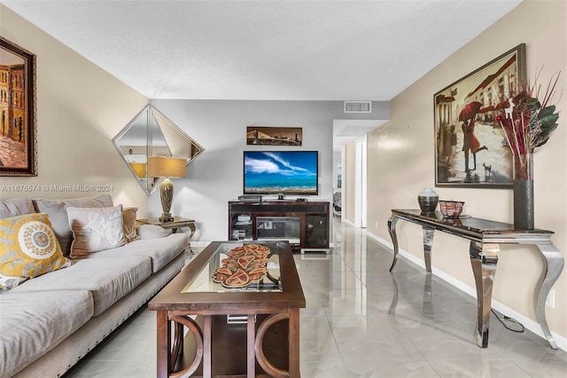 living room with a textured ceiling