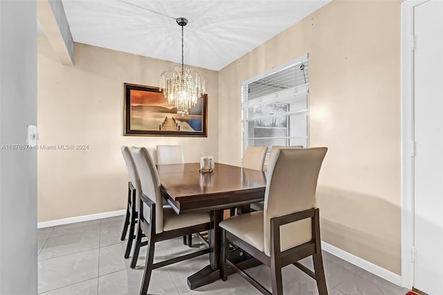 dining space with a chandelier