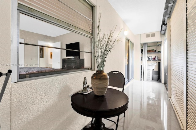 corridor featuring tile patterned flooring