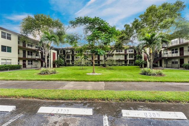 view of property's community with a yard