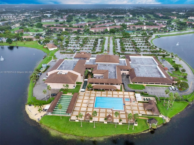 birds eye view of property featuring a water view