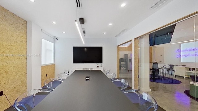 home office with concrete flooring