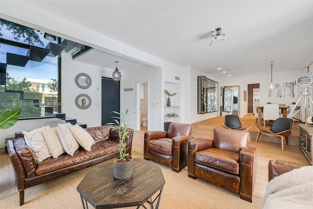 living room with light hardwood / wood-style flooring