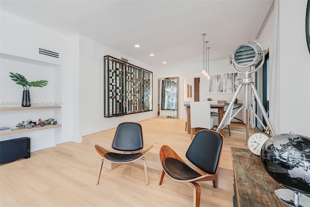 sitting room featuring light hardwood / wood-style flooring