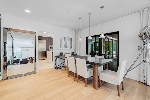 dining space featuring light hardwood / wood-style flooring