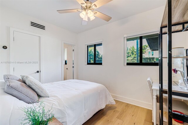 bedroom featuring light wood-type flooring and ceiling fan