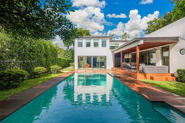 view of pool featuring a wooden deck