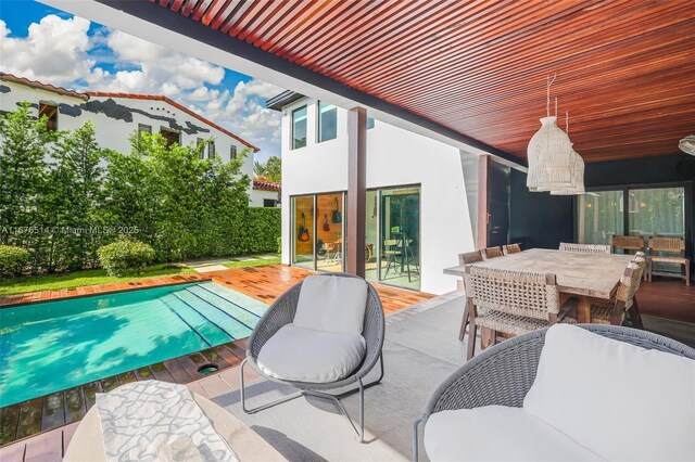 view of patio / terrace with a pool side deck