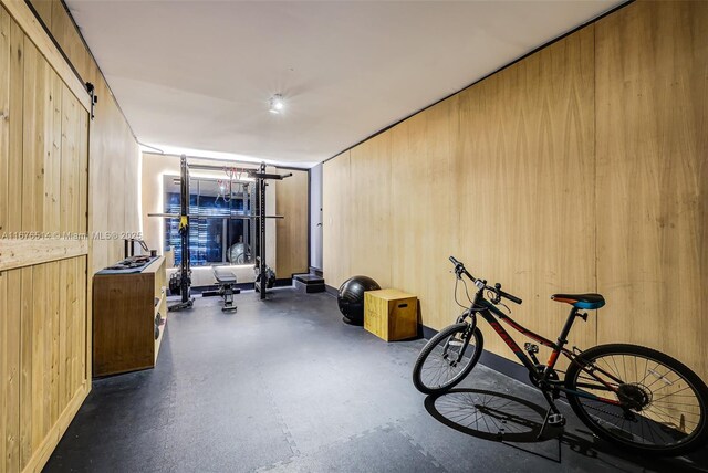 workout area featuring wooden walls