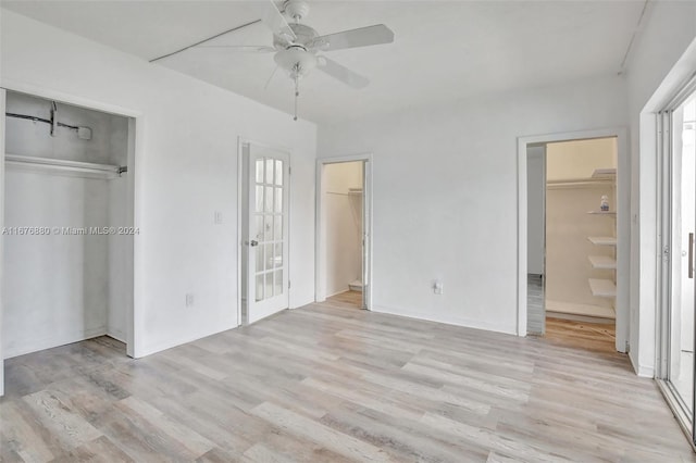 121 NE 204th St Unit 9, Miami Gardens, FL 33179 - unfurnished bedroom with light wood finished floors, a closet, ceiling fan, and ensuite bathroom
