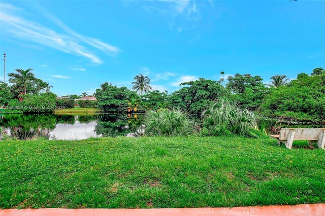 121 NE 204th St Unit 9, Miami Gardens, FL 33179 - view of yard featuring a water view