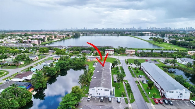 birds eye view of property featuring a water view