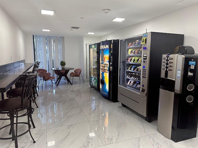 3300 NE 192nd St Unit 414, Aventura, FL 33180 - kitchen featuring light marble finish flooring and floor to ceiling windows