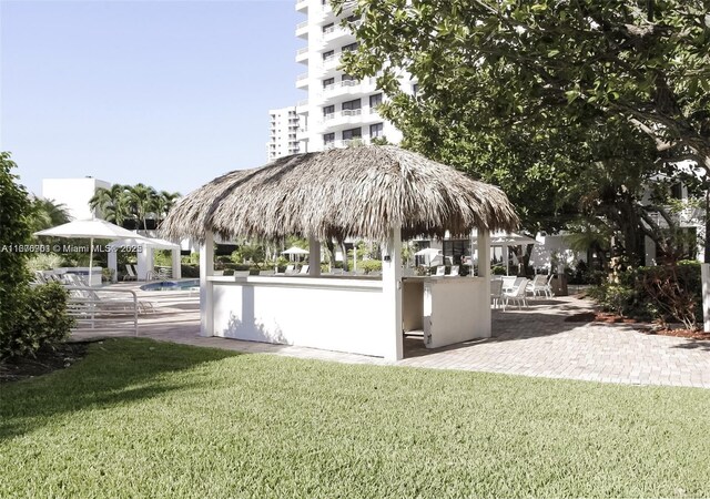 3300 NE 192nd St Unit 414, Aventura, FL 33180 - view of community with a gazebo, a pool, a patio area, and a yard