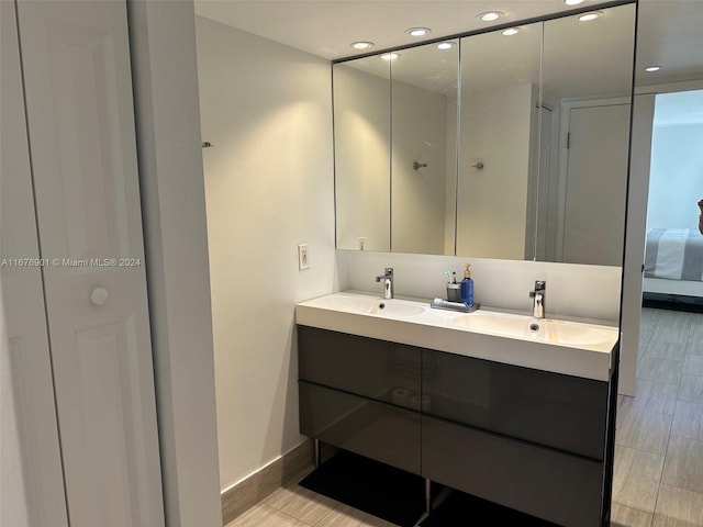 bathroom with vanity and wood-type flooring