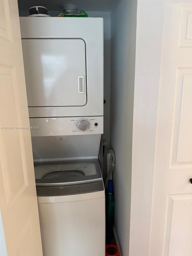 3300 NE 192nd St Unit 414, Aventura, FL 33180 - laundry area with stacked washer and clothes dryer