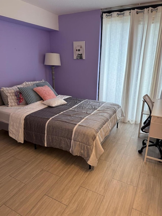 3300 NE 192nd St Unit 414, Aventura, FL 33180 - bedroom with light wood-style flooring