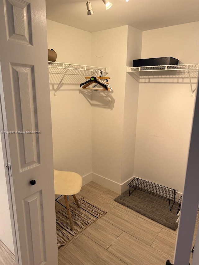 3300 NE 192nd St Unit 414, Aventura, FL 33180 - spacious closet featuring wood finished floors