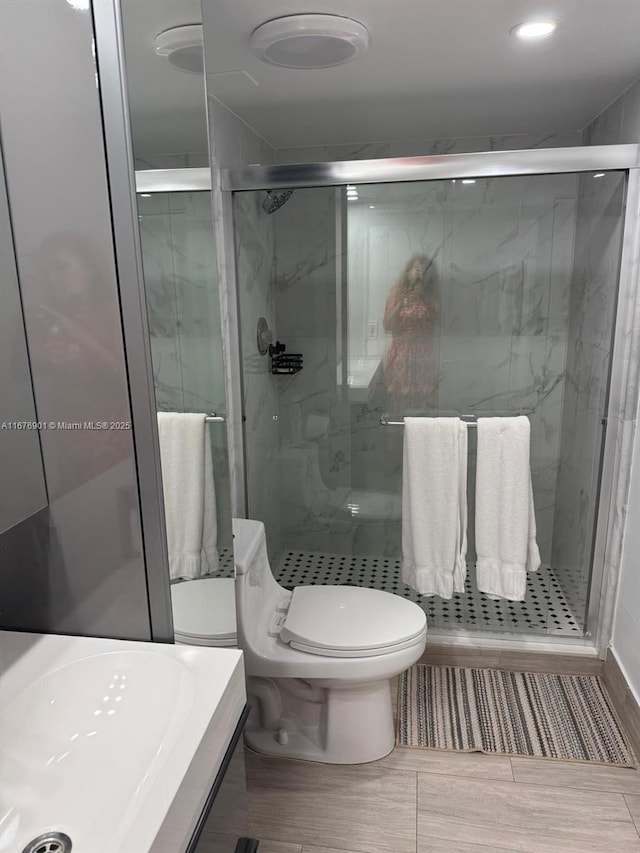 3300 NE 192nd St Unit 414, Aventura, FL 33180 - full bathroom with toilet and a shower stall