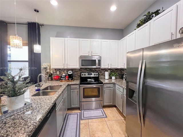 kitchen featuring white cabinetry, stainless steel appliances, and sink