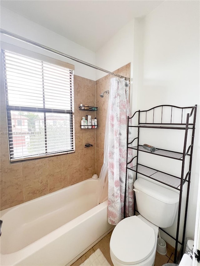 bathroom with toilet and shower / bath combo