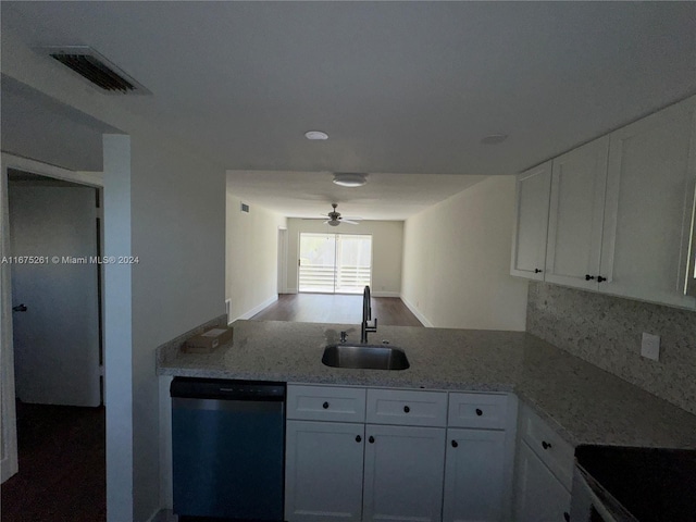 kitchen with sink, dishwasher, ceiling fan, white cabinets, and light stone counters