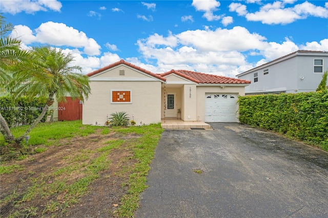 mediterranean / spanish-style home featuring a garage