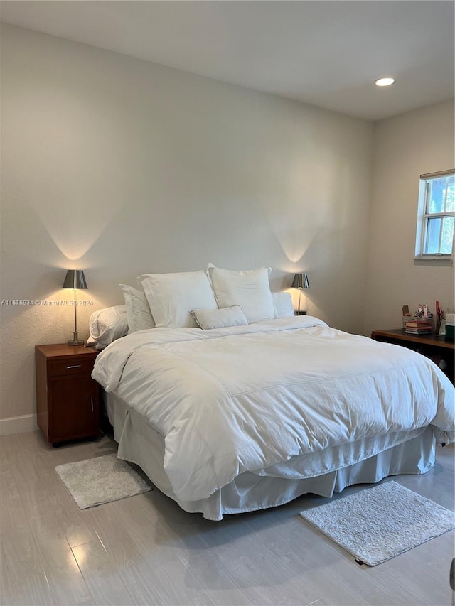 bedroom with light hardwood / wood-style floors