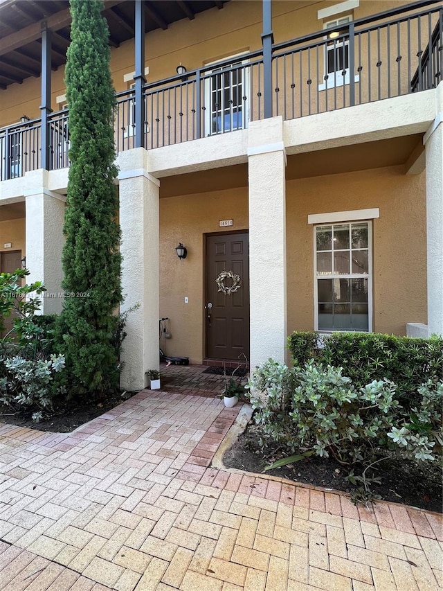 property entrance with a balcony