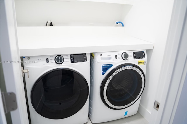 laundry room featuring washing machine and dryer