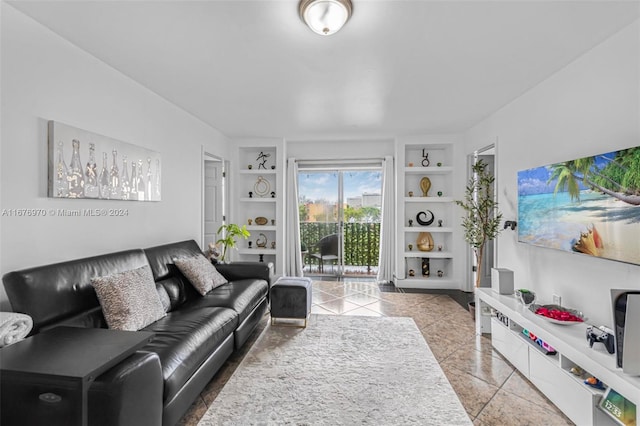 tiled living room featuring built in shelves