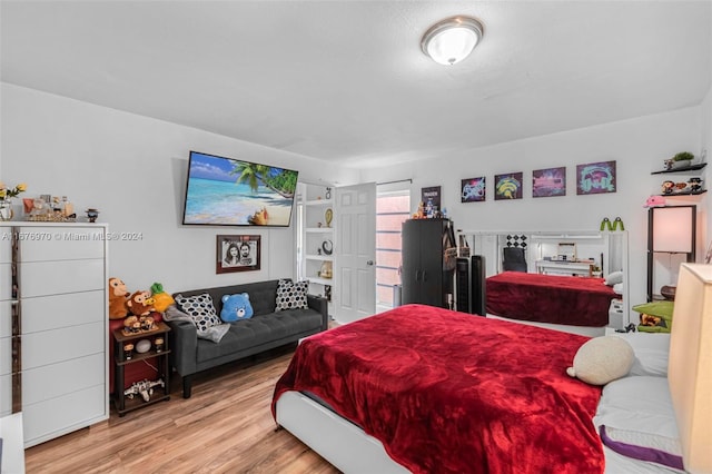 bedroom with light hardwood / wood-style flooring