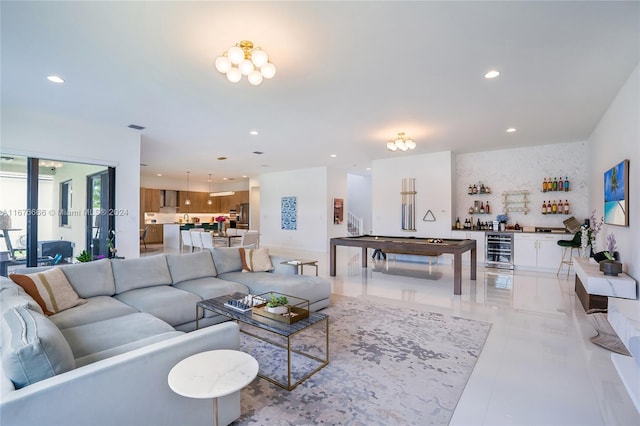 living room featuring pool table, bar area, and beverage cooler